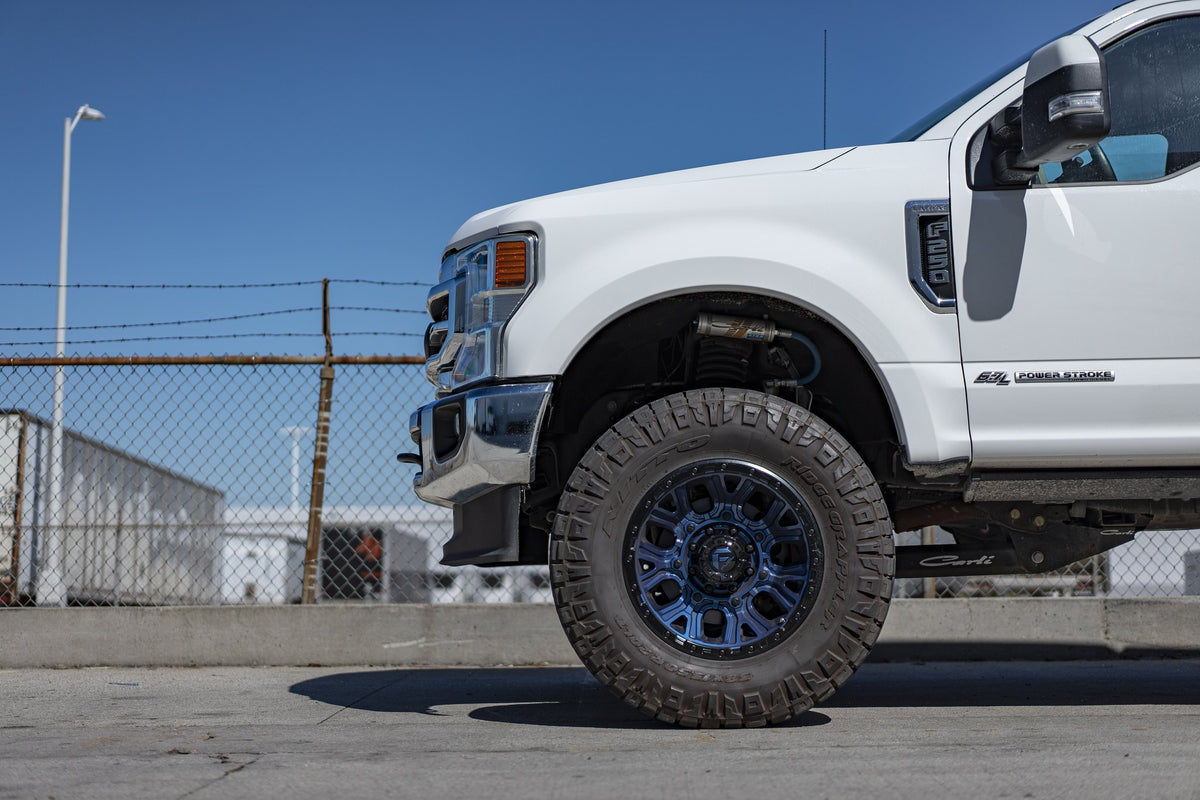 Fuel Off-Road D827 Traction Dark Blue with Black Ring on a Ford F250
