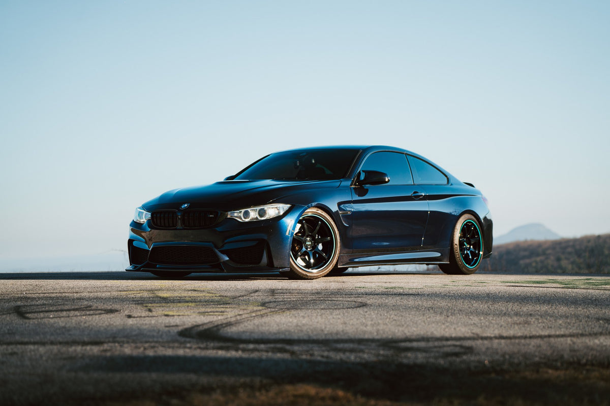 Rotiform RC208 BPU Gloss Black with Teal Stripe on a 2019 BMW M4